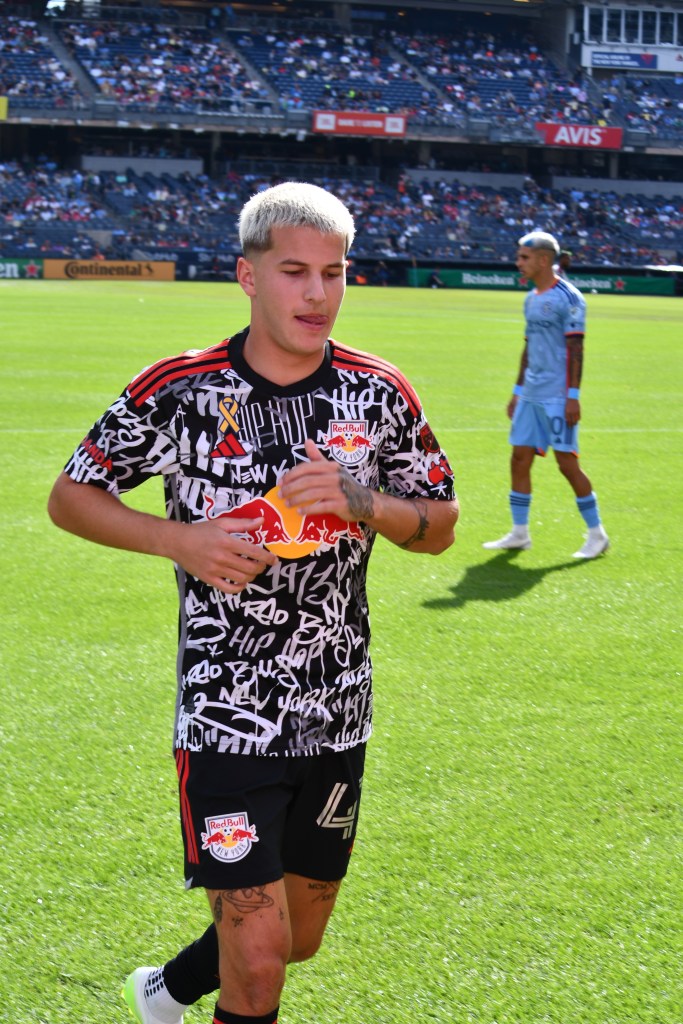 John Tolkin aka JMi of the New York Red Bulls. Keaton Parks and NYCFC teammate during stoppage in play at Yankee Stadium. Credit: Bad Dawg Sports/Sean McCaffery