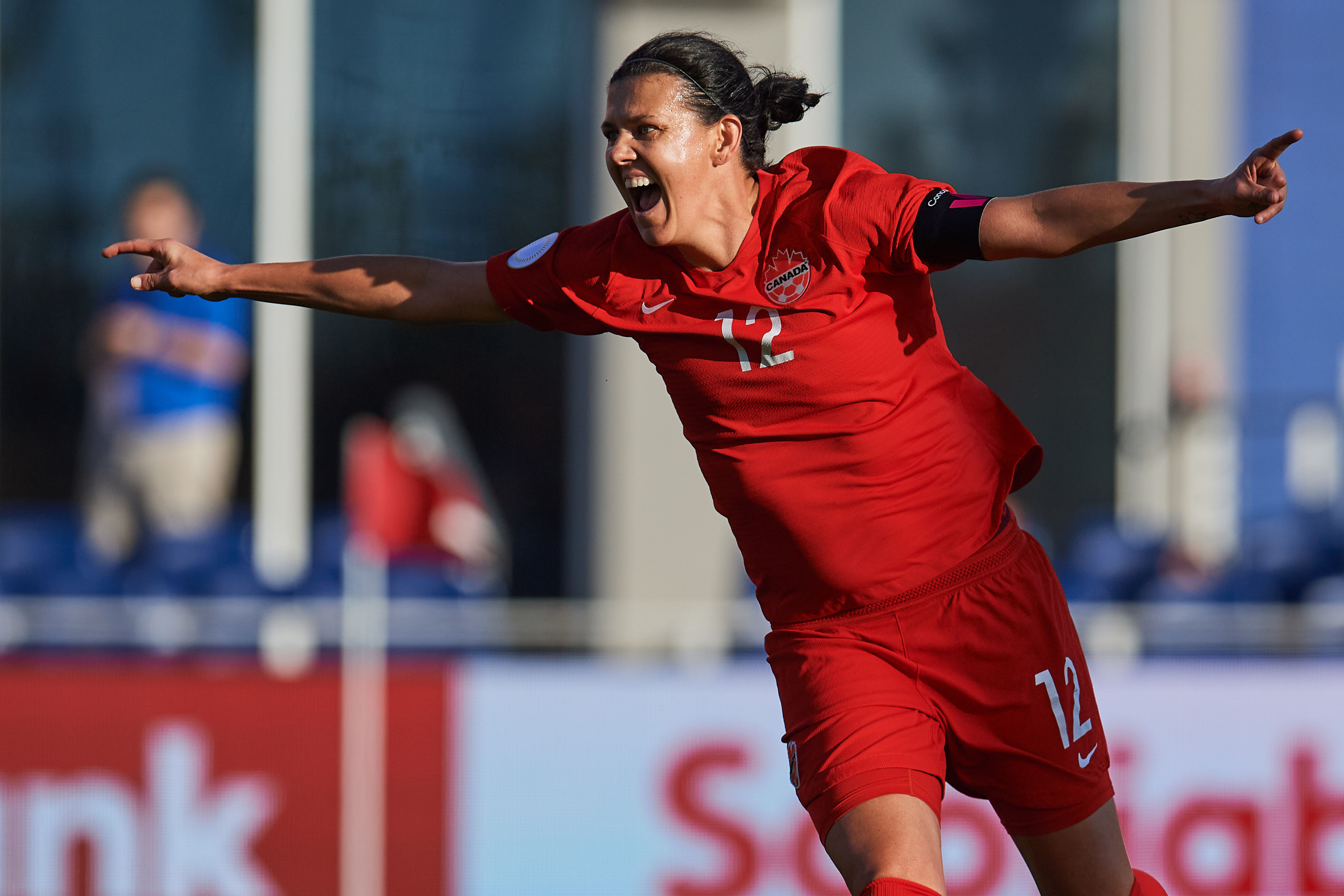 Canadian women's soccer player Christine Sinclair celebrating a goal for Canada.