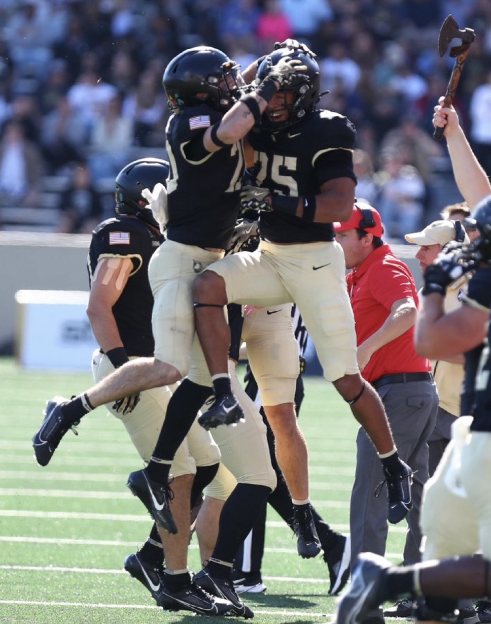 Army players celebrating a turnover. Mandatory Credit: Army Black Knight Football