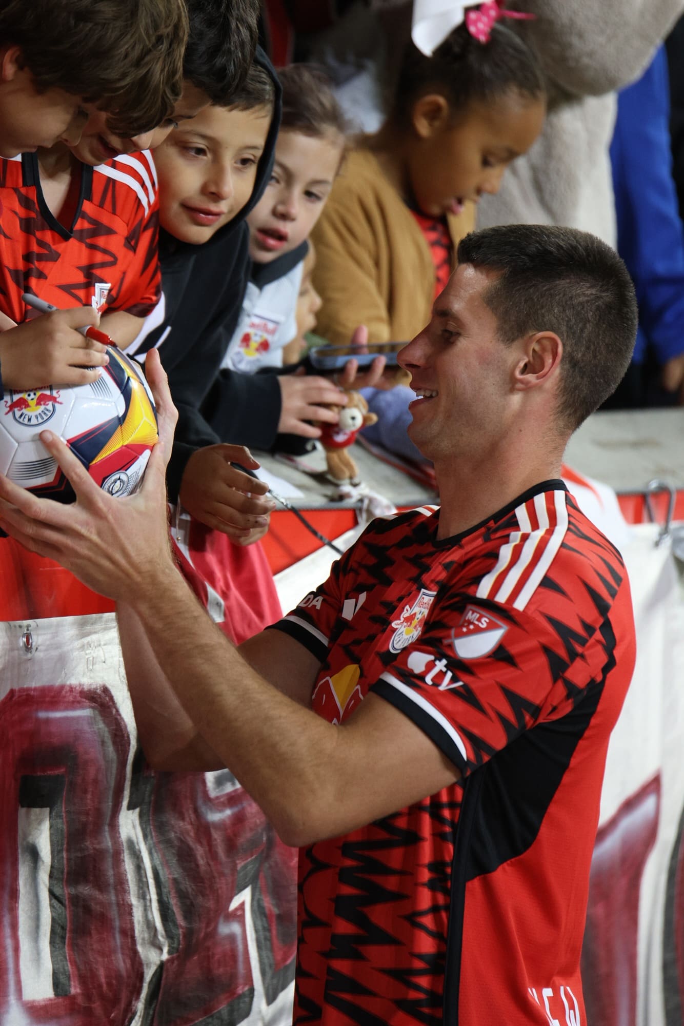 11/3/24, Harrison NJ, Red Bull Arena Sean Nealis signing autographs soccer ball Mandatory Credit: Jose Pichirilo /Bad Dawg Sports