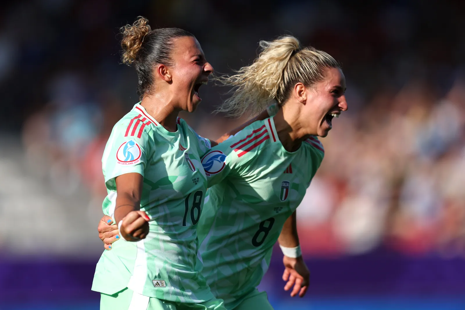 SION, SWITZERLAND - JULY 03: Arianna Caruso of Italy celebrates with teammate Emma Severini after scoring her team's first goal during the UEFA Women's EURO 2025 Group B match between Belgium and Italy at Stade de Tourbillon on July 03, 2025 in Sion, Switzerland. (Photo by Charlotte Wilson - UEFA/UEFA via Getty Images)