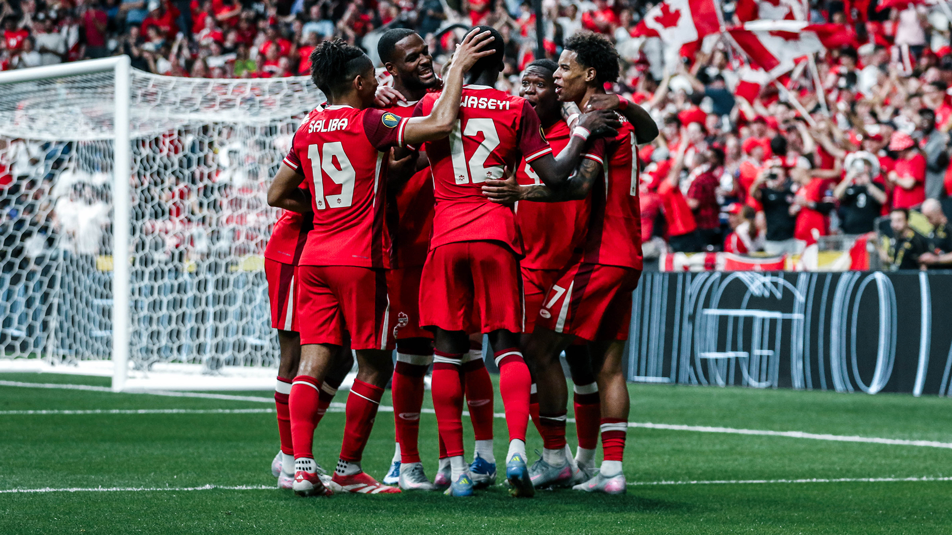 Canadian players celebrate a goal.