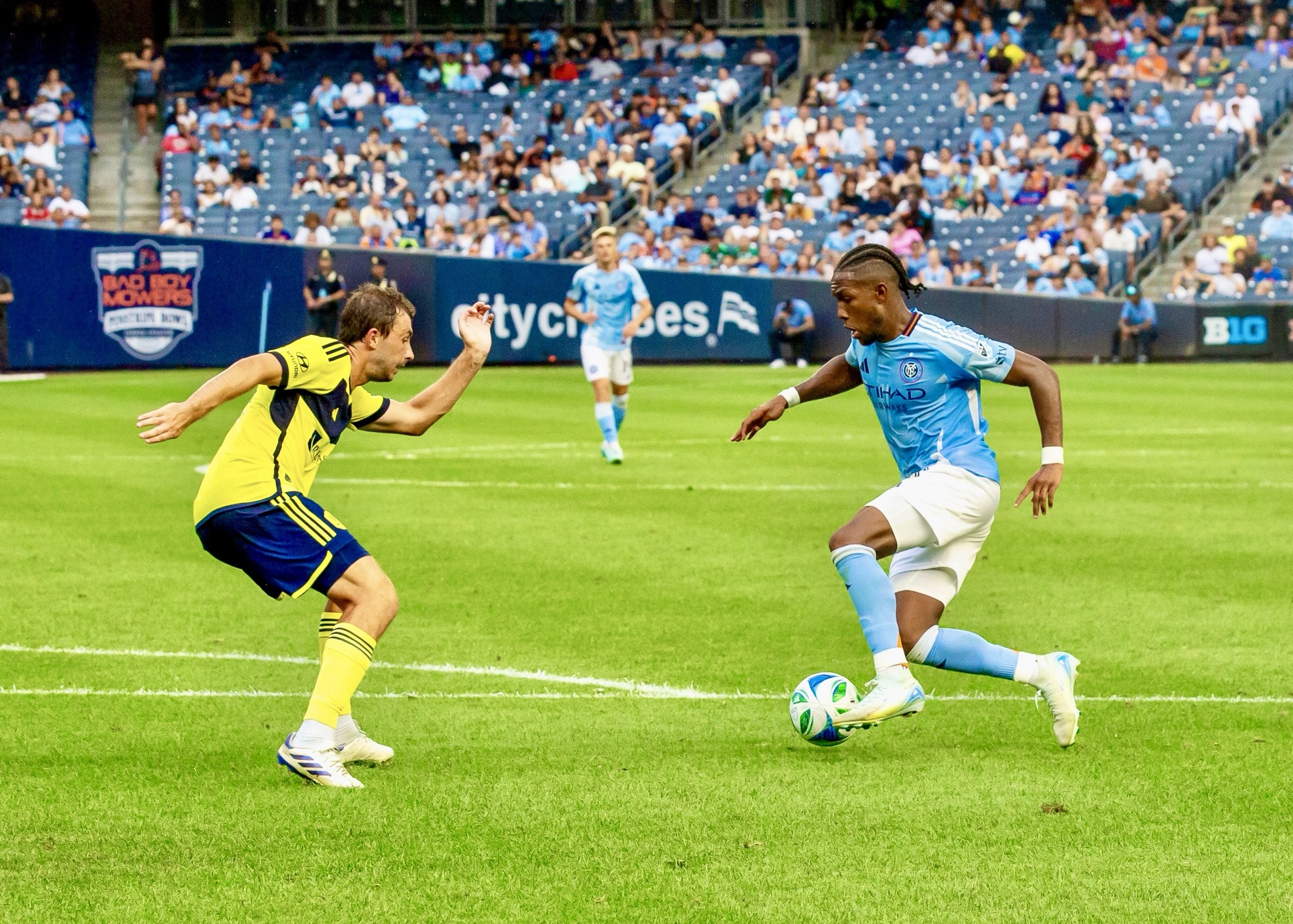 Andres Perea number 8 of New York City FC controls ball while pressured by Jack Maher number 5 of Nashville SC