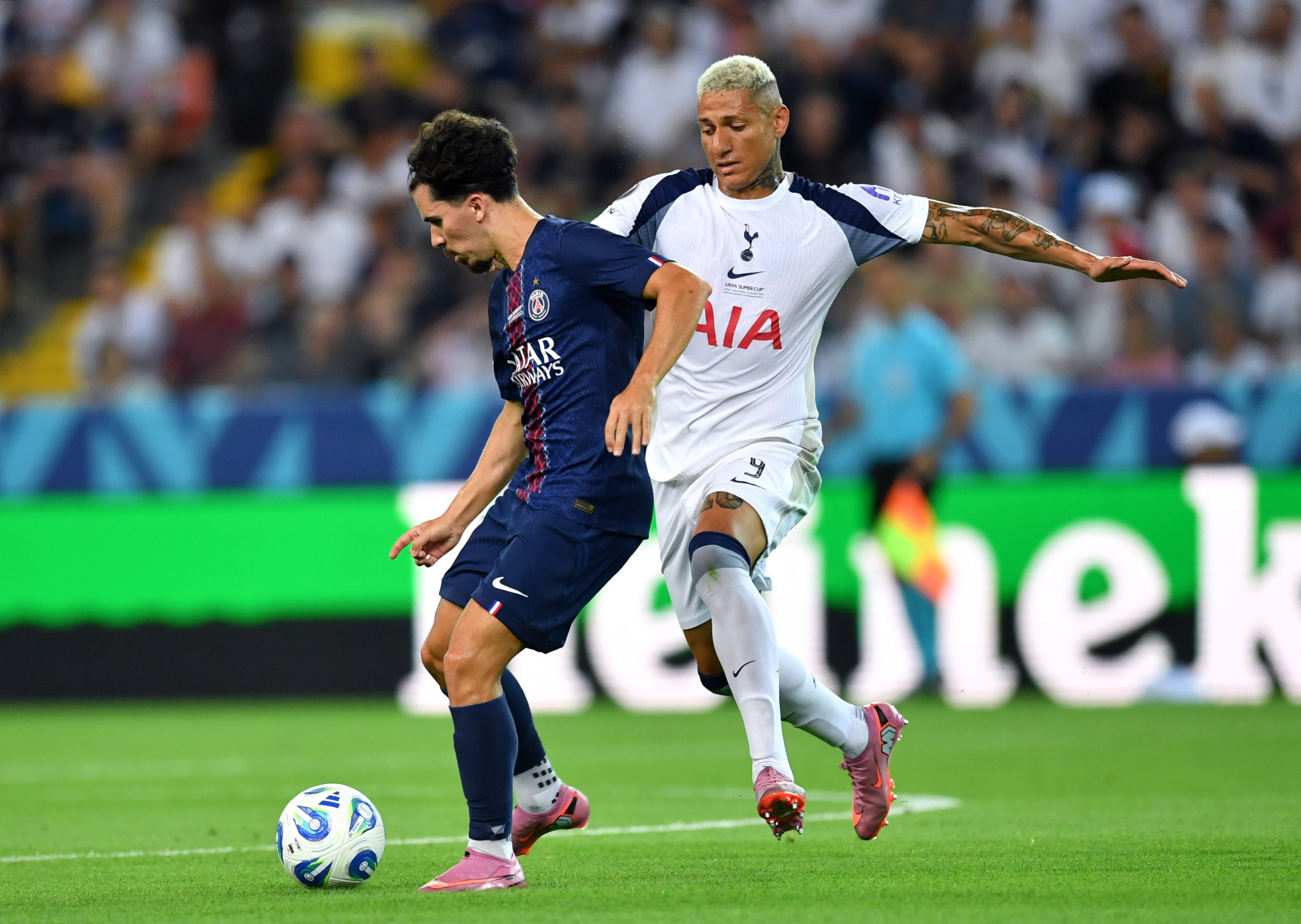 Vitinha is being challenged for the ball. Mandatory Credit UEFA.com