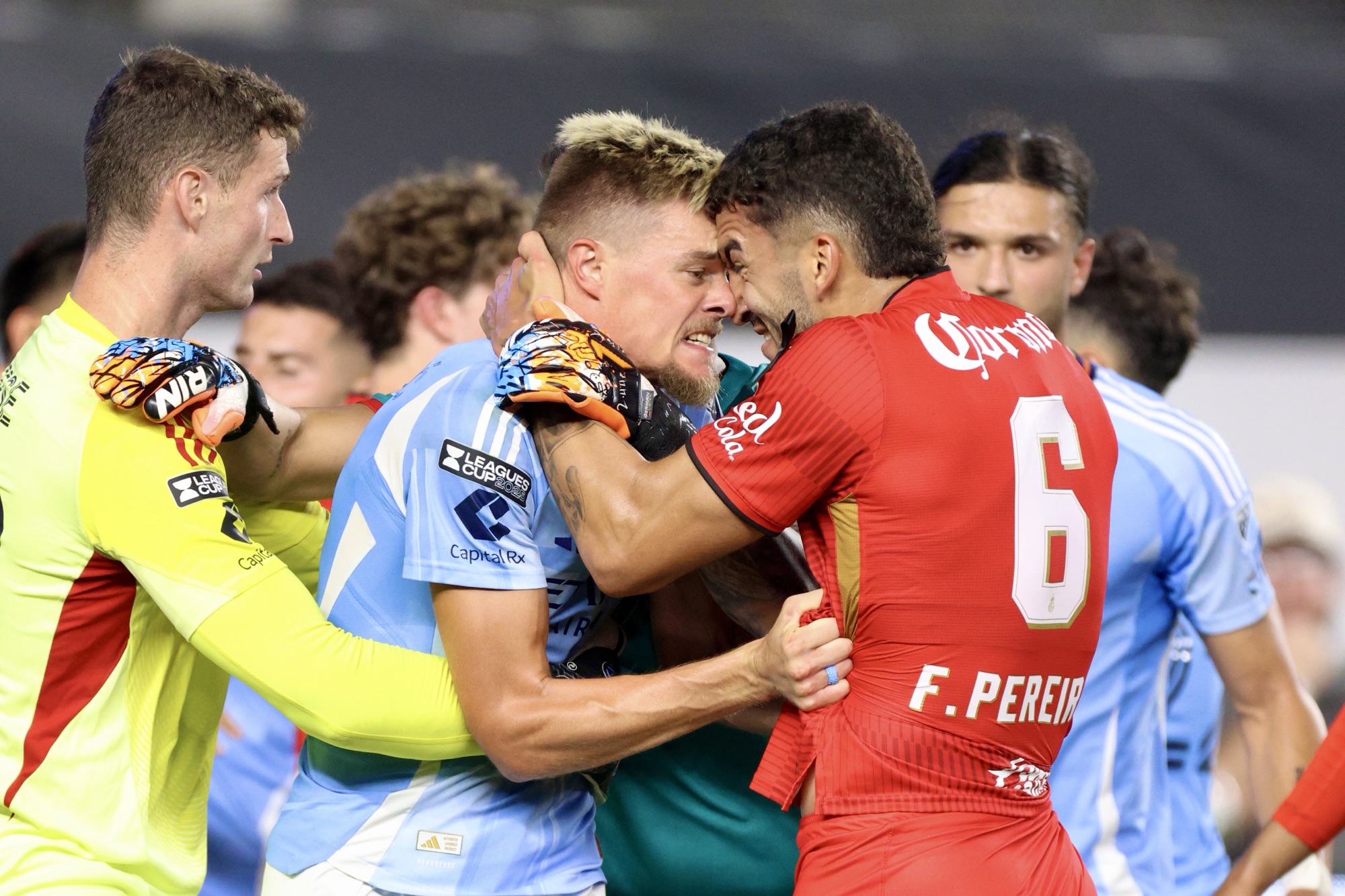 8/5/25, Bronx, New York City, Yankees Stadium, Players clash in the first half of the Leagues Cup Phase One matchup between Deportivo Toluca FC and New York City FC. Mandatory Credit: Jose Pichirilo/Bad Dawg Sports