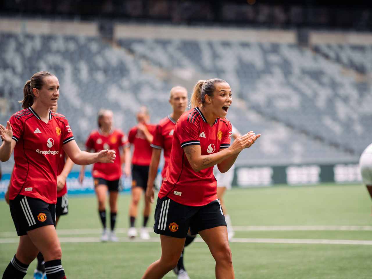 Manchester United Women's footballer celebrates passionately after scoring a goal during UEFA Women's Champions League qualifier