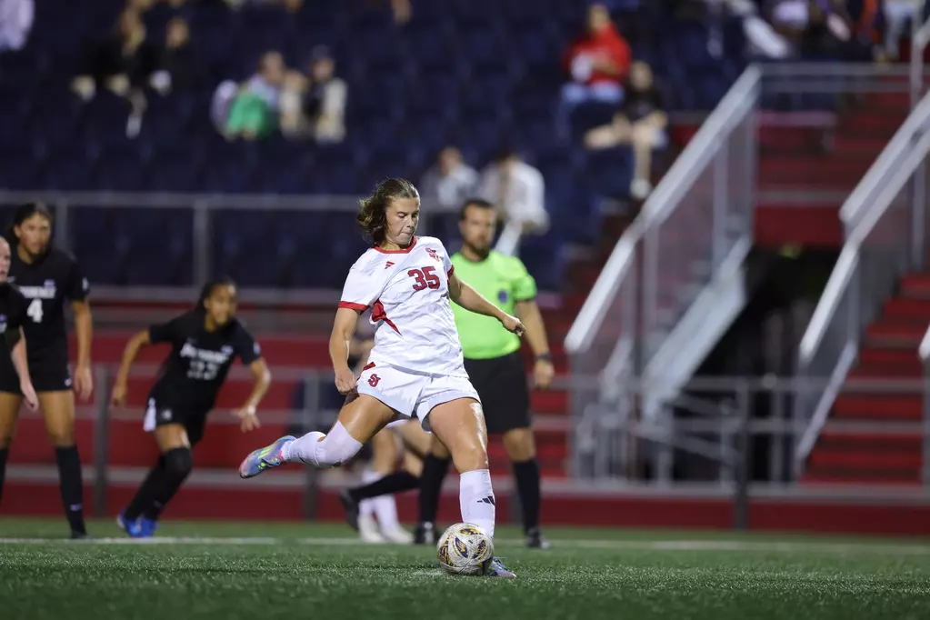 St. John's Red Storm women's soccer team celebrates dramatic 1-1 draw against Providence College after Telma Steindórsdóttir's penalty kick equalizer with 0.9 seconds remaining in first half at Cox Family Field at Belson Stadium