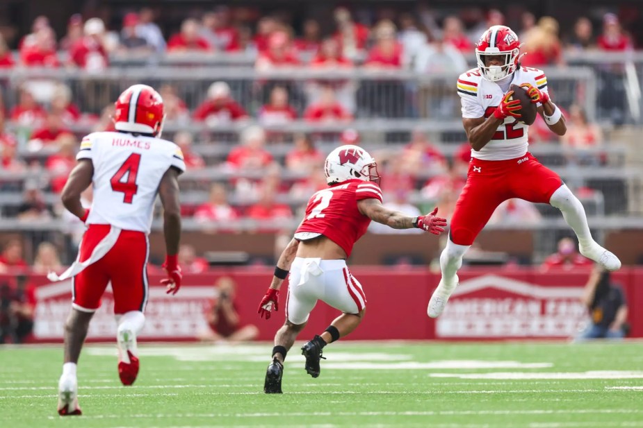 Maryland Terrapins defensive back Jalen Huskey (#22) secures an interception against the Wisconsin Badgers during the Big Ten conference opener at Camp Randall Stadium