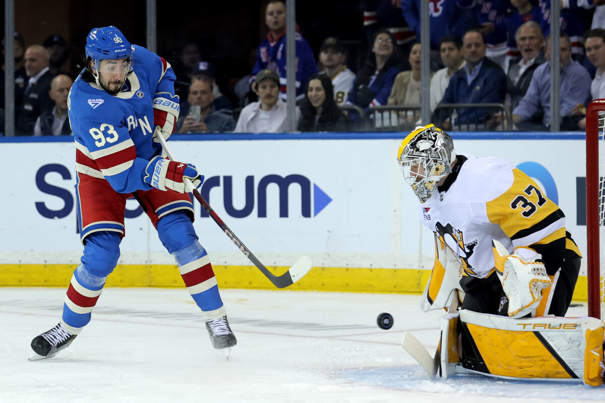 Oct 7, 2025; New York, New York, USA; New York Rangers center Mika Zibanejad (93) takes a shot against Pittsburgh Penguins goaltender Arturs Silovs (37) during the first period at Madison Square Garden. Mandatory Credit: Brad Penner-Imagn Images