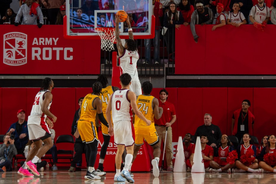 St. John's Red Storm guard Ian Jackson dunks the basketball during the second-half comeback against Towson at Carnesecca Arena. Jackson's aggressive finishing was key to St. John's' 73-63 exhibition victory.