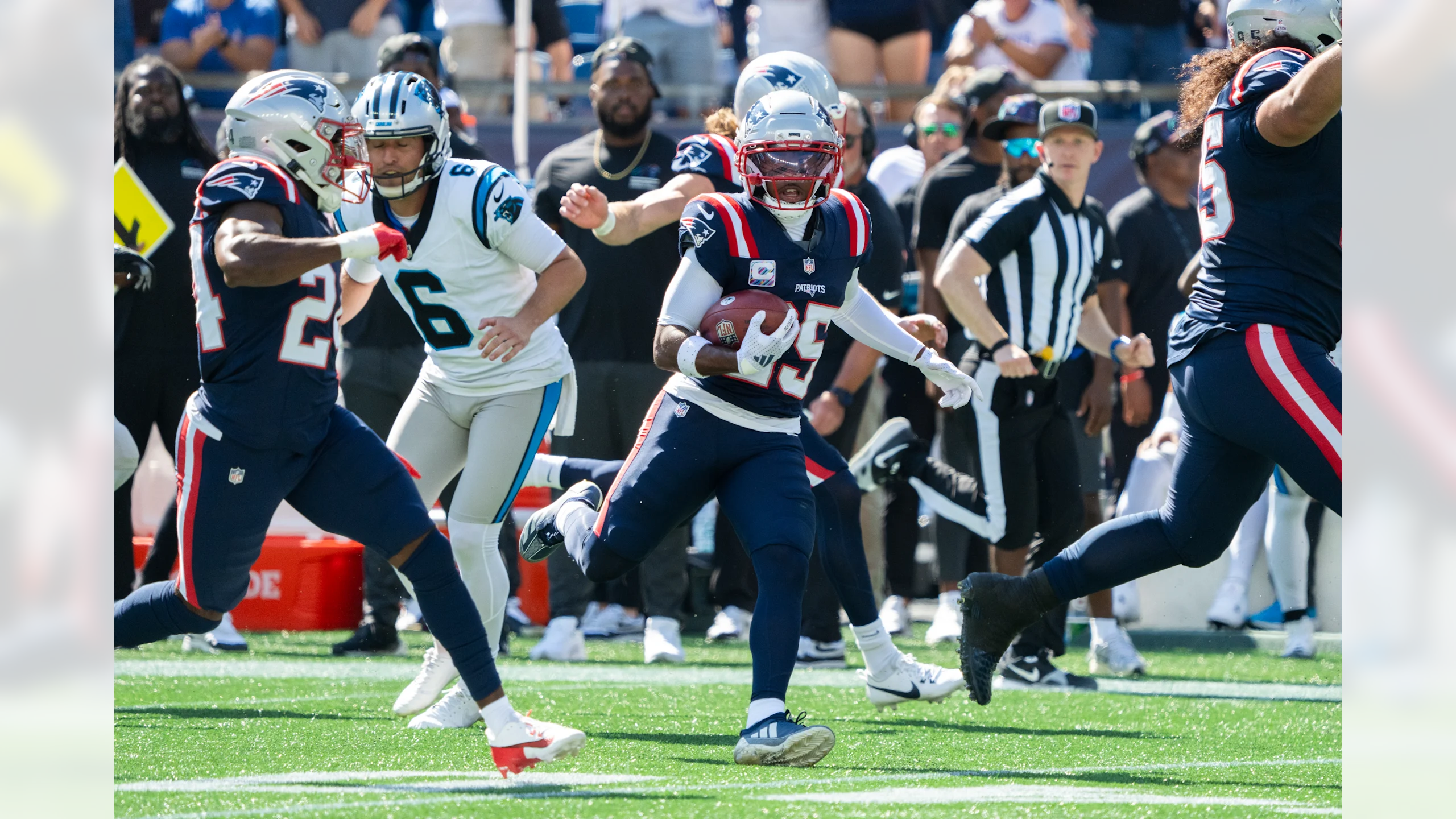 New England Patriots cornerback Marcus Jones returns a punt 87 yards for a touchdown against the Carolina Panthers in the first quarter at Gillette Stadium on September 28, 2025