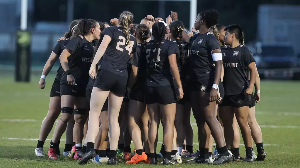 Army West Point women's rugby team huddles together before their NIRA semifinal matchup against Lindenwood at Hunter Stadium in St. Charles, Missouri.
