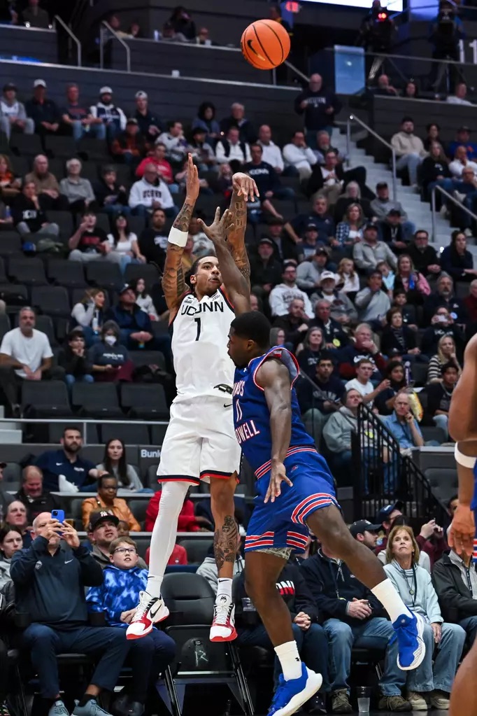 UConn Huskies guard Solo Ball #1 drives against UMass Lowell River Hawks during 110-47 blowout victory at PeoplesBank Arena in Hartford Connecticut on November 7 2025 in NCAA college basketball game