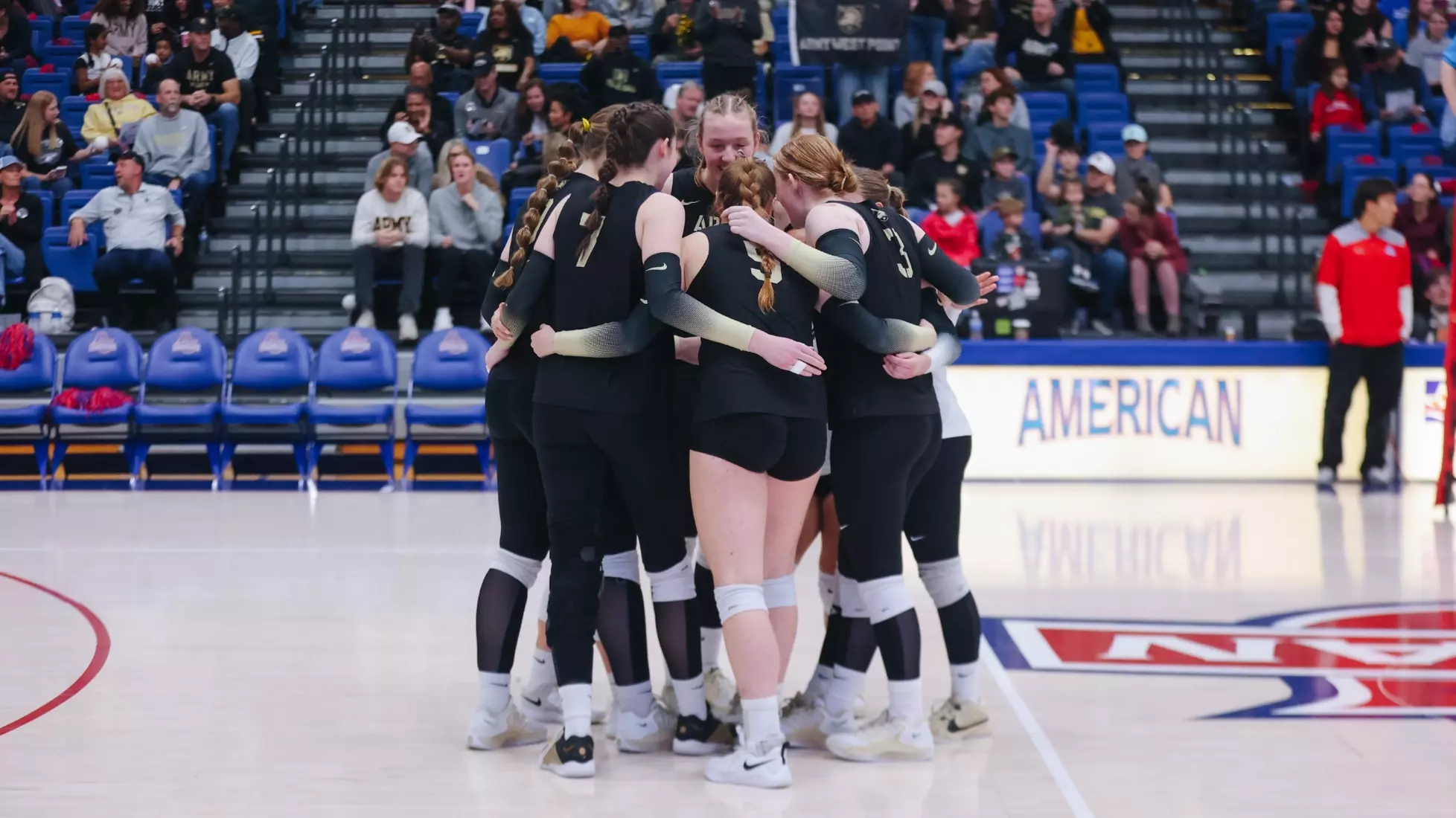 Army West Point volleyball team huddles together on the court before a set during the 2025 Patriot League Championship against American University at Bender Arena in Washington, D.C., on November 23, 2025.
