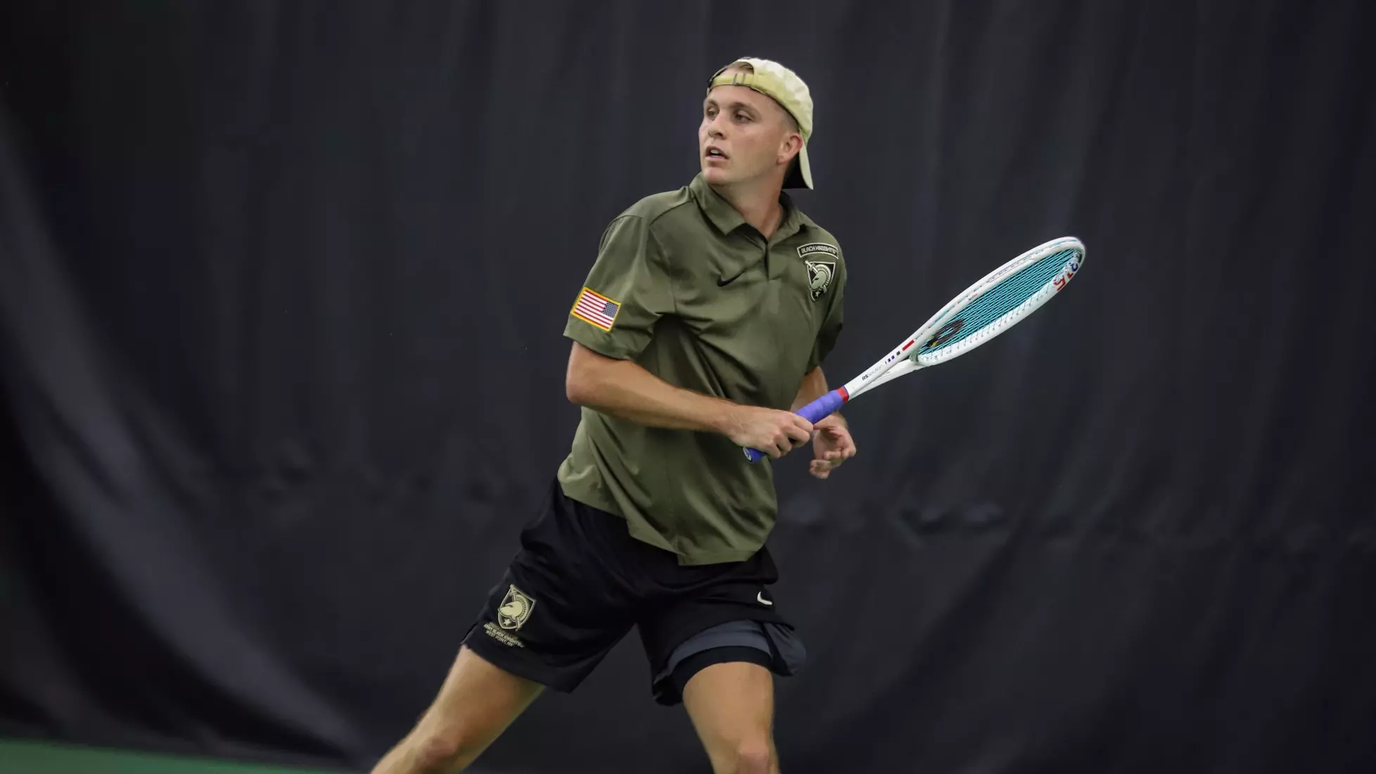 Army West Point men’s tennis player Preston Achter prepares to hit a shot during a match vs. Pratt CC at the Lichtenberg Tennis Center.