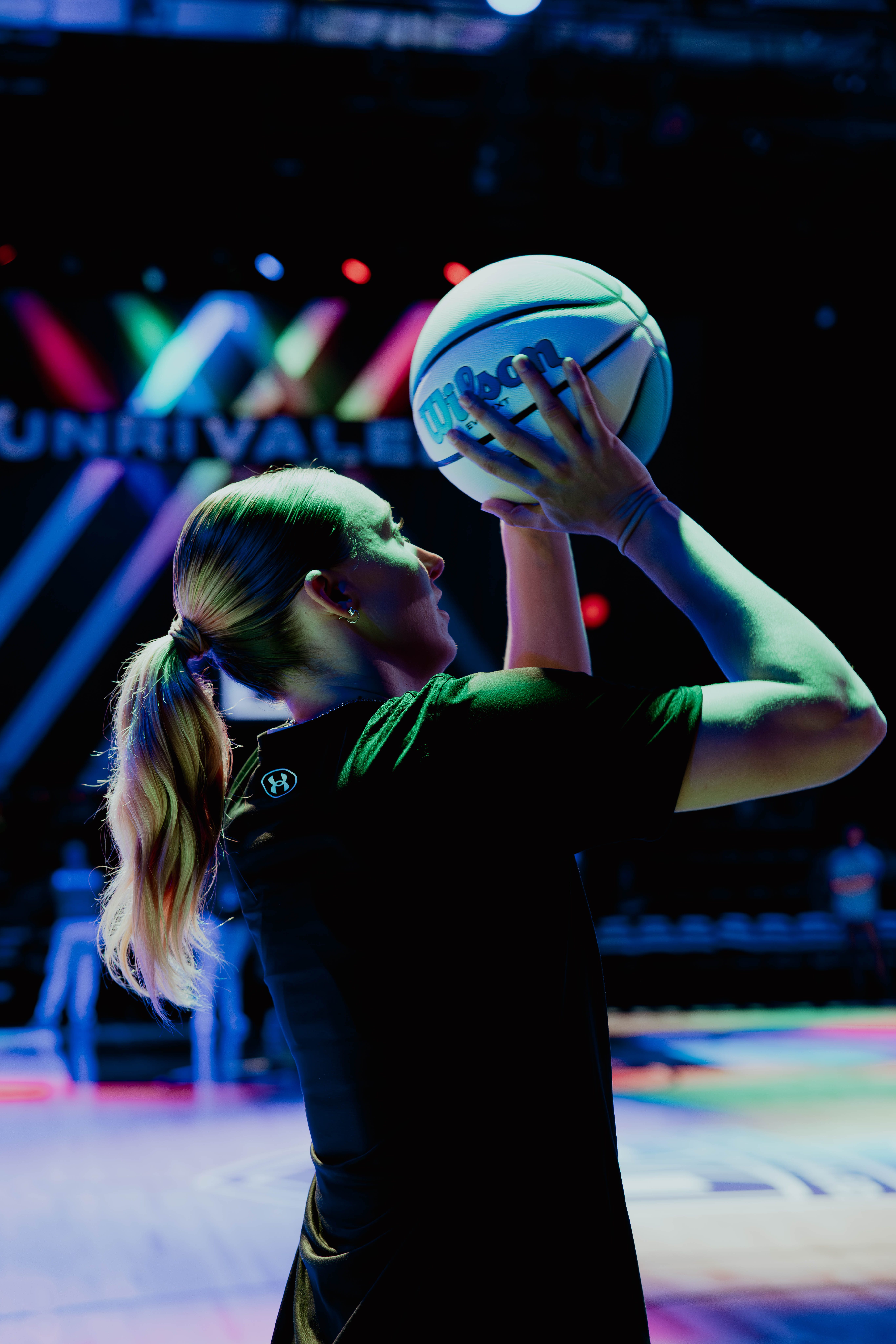 Paige Bueckers of Breeze BC shooting a basketball during warmups, wearing black training gear.