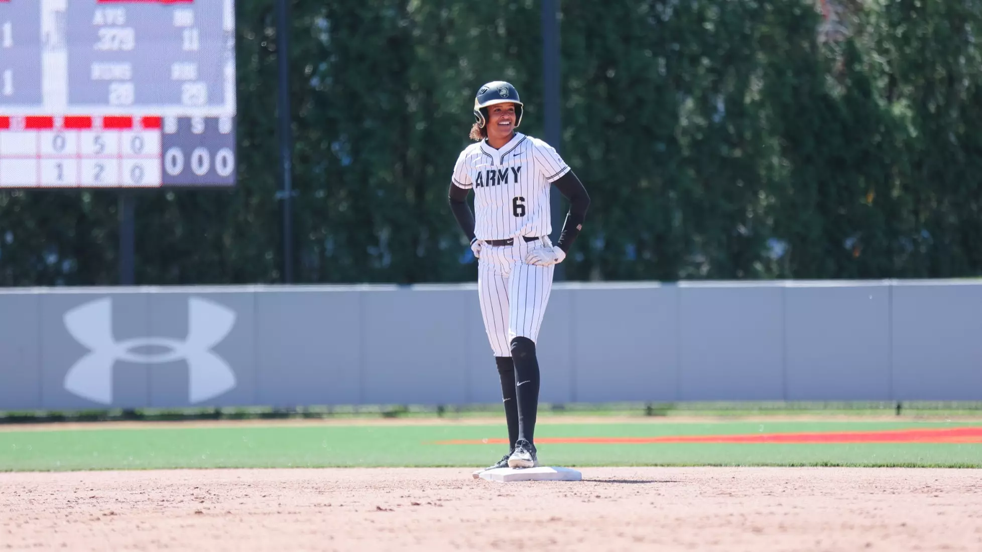 Army softball player Taylor Brown stands on second base in an Army pinstriped uniform during a game at FAU Softball Stadium in Boca Raton, Florida.