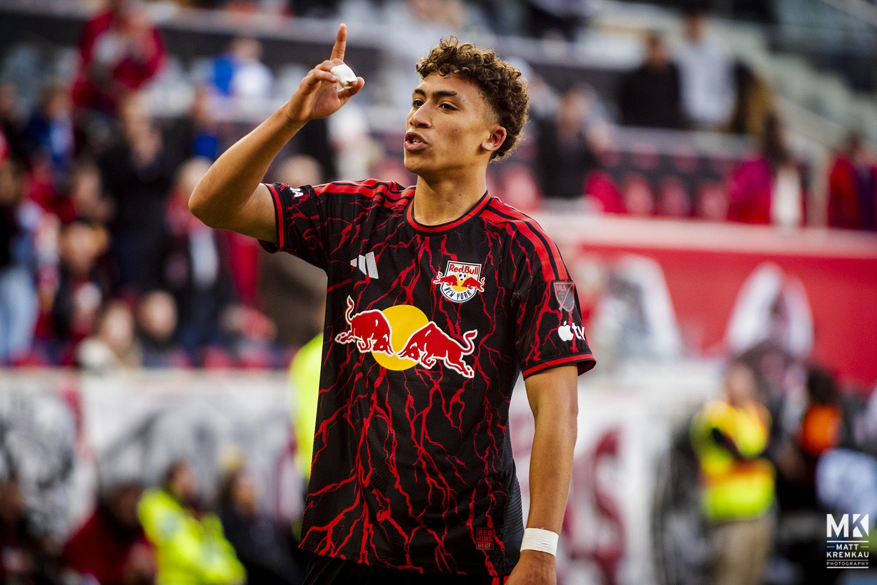 Julian Hall celebrates after scoring the opening and game‑winning goal for Red Bull New York against the New England Revolution during the 2026 home opener in Harrison, New Jersey. Mandatory Credit: MLS.